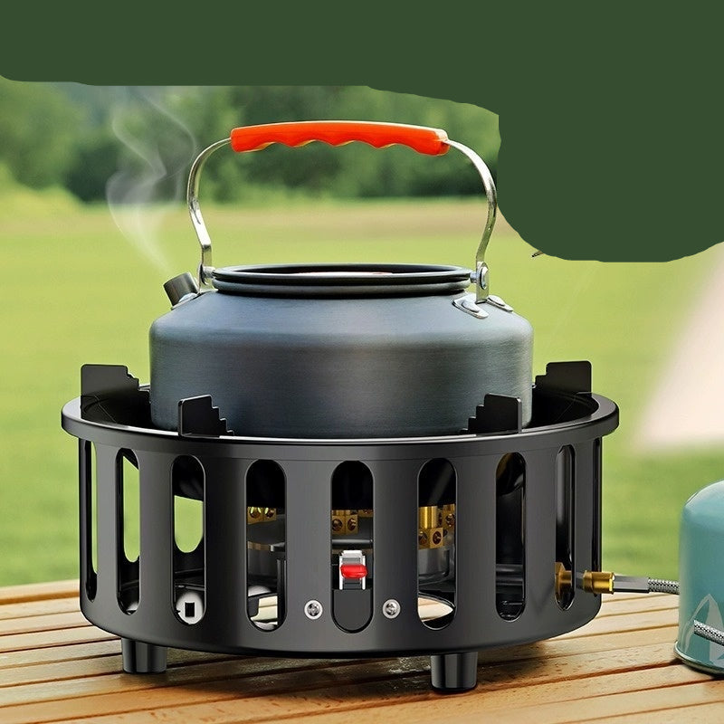 Portable stove with electronic ignition on a wooden surface outdoors