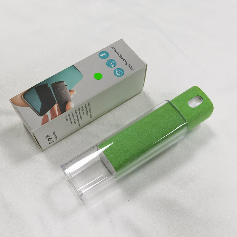Green cleaning brush with packaging on a white background