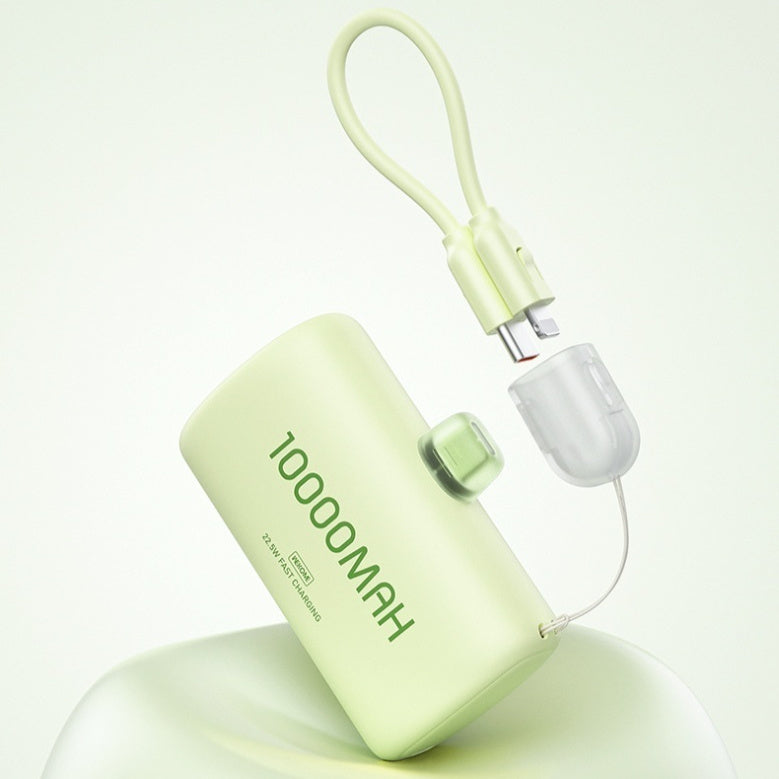 Green portable battery pack with USB cable on a white background