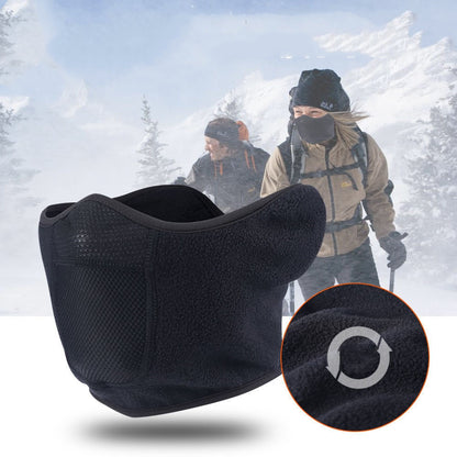 Black neck warmer with mesh design in front of a snowy landscape with people skiing.